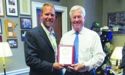Mick Miller with DENCO II presents Rep. Collin Peterson with a Growth Energy award for his outstanding leadership and support of the Biofuels Industry.